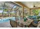 Enjoy the screened patio, with dining and seating areas, and a swimming pool providing a perfect setting for outdoor living at 10105 Holly Berry Dr, Weeki Wachee, FL 34613