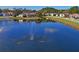 Scenic view of a pond, enhancing the beauty and tranquility of the community at 10105 Holly Berry Dr, Weeki Wachee, FL 34613