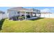 Expansive backyard featuring a screened lanai and ample green space at 1014 Coastal Hammock Ave, Ruskin, FL 33570