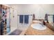 Bathroom featuring double vanity, granite countertop, and a walk-in shower with a fun cow-themed shower curtain at 1014 Coastal Hammock Ave, Ruskin, FL 33570