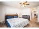 Bedroom with ceiling fan, bedside table, and large window at 1014 Coastal Hammock Ave, Ruskin, FL 33570