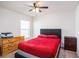 Bedroom with a large window, carpet floors, a ceiling fan, and furniture at 1014 Coastal Hammock Ave, Ruskin, FL 33570