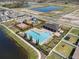Aerial view of community pool, playground, and recreational amenities at 1014 Coastal Hammock Ave, Ruskin, FL 33570
