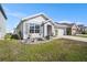 Lovely one-story home with a well-kept lawn, tidy garden beds, and an attached two car garage at 1014 Coastal Hammock Ave, Ruskin, FL 33570