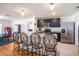 Modern kitchen with stainless steel appliances, granite counters, and breakfast bar at 1014 Coastal Hammock Ave, Ruskin, FL 33570