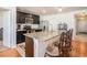 Kitchen featuring stainless steel appliances and granite countertop island with seating at 1014 Coastal Hammock Ave, Ruskin, FL 33570