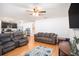 Open-concept living room with hardwood floors, connecting to the kitchen, perfect for Gathering gatherings at 1014 Coastal Hammock Ave, Ruskin, FL 33570