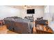Spacious living room with hardwood floors and comfortable seating arrangements, great for relaxing and entertaining guests at 1014 Coastal Hammock Ave, Ruskin, FL 33570