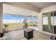 Enclosed patio with a backyard view, fire pit, and tiled floor at 1014 Coastal Hammock Ave, Ruskin, FL 33570