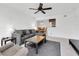 Cozy living area with a large sectional sofa, rug, and ceiling fan at 10200 Gandy N Blvd # 412, St Petersburg, FL 33702