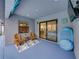 Relaxing screened lanai with tile flooring, outdoor furniture, and seamless access to the home's interior at 12811 Wheatgrass Ct, Parrish, FL 34219