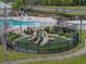 Community playground featuring slides and climbing structures for enjoyment and active play at 12811 Wheatgrass Ct, Parrish, FL 34219