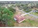 Aerial view of home showcasing its unique roofline and spacious lot at 1286 Barranca Ave, Spring Hill, FL 34609