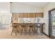 Open kitchen featuring bar seating, stainless steel appliances and outside access at 1286 Barranca Ave, Spring Hill, FL 34609