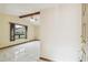 Bright living room with beamed ceilings, large windows, and tiled floors at 1286 Barranca Ave, Spring Hill, FL 34609