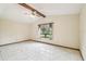 Bright living room with beamed ceilings, and a large window with natural light at 1286 Barranca Ave, Spring Hill, FL 34609