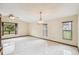 Airy living room featuring a large window and bright elegant lighting at 1286 Barranca Ave, Spring Hill, FL 34609