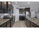 Spacious kitchen featuring stainless steel appliances, granite countertops, and a center island at 13359 Golden Lime Ave, Spring Hill, FL 34609
