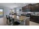 Island kitchen with granite countertops, stainless steel appliances, and breakfast bar at 13359 Golden Lime Ave, Spring Hill, FL 34609
