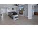 Comfortable living room with fireplace, tile flooring, large ceiling fan, and neutral colors at 13359 Golden Lime Ave, Spring Hill, FL 34609