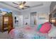 Large main bedroom with tray ceiling and ensuite bathroom at 13359 Golden Lime Ave, Spring Hill, FL 34609