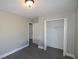 This bright bedroom features a closet and updated floors at 13728 1St St, Dade City, FL 33525