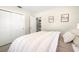 Light and airy bedroom showcases closet space and simple, stylish decor at 138 Edgewater Ter, Dunedin, FL 34698