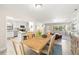 Well-lit dining area adjacent to kitchen offering a welcoming space for meals and gatherings at 138 Edgewater Ter, Dunedin, FL 34698