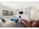 Cozy living room with custom built-ins and entertainment center providing ample storage space at 138 Edgewater Ter, Dunedin, FL 34698