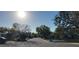 View along a quiet street with mature trees and well-maintained landscaping at 138 Edgewater Ter, Dunedin, FL 34698