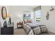 Cozy bedroom features a comfortable bed, a window with natural light, and tasteful decor for a welcoming ambiance at 17468 Whiskey Creek Trl, Parrish, FL 34219