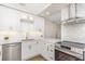 Modern kitchen with stainless steel appliances, stone backsplash and breakfast bar at 2403 Finlandia Ln # 27, Clearwater, FL 33763