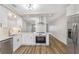 Modern eat-in kitchen with stainless steel appliances, new cabinets and hardware at 2403 Finlandia Ln # 27, Clearwater, FL 33763