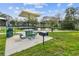 Charming picnic area near a pond with a grill for outdoor cooking and relaxation at 2403 Finlandia Ln # 27, Clearwater, FL 33763