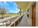 Hallway view of unit 7 with beautiful landscaping and view of open recreational space at 2403 Finlandia Ln # 27, Clearwater, FL 33763