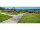 Community water access featuring colorful kayaks and a wooden walkway with a dock at 2403 Finlandia Ln # 27, Clearwater, FL 33763