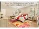 Bright bedroom with a floral rug and a desk under the windows at 25325 Welsh Poppy Way, Land O Lakes, FL 34639