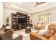 Inviting living room boasts a decorative ceiling, wood floors, and a built-in entertainment center at 25325 Welsh Poppy Way, Land O Lakes, FL 34639