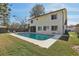 Large pool and spacious backyard with lush green grass, offering an ideal space for outdoor activities and relaxation at 2717 Warwick Ter, Palm Harbor, FL 34685