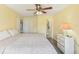 Bright bedroom featuring a ceiling fan, closet, and view to the bathroom and additional rooms at 2717 Warwick Ter, Palm Harbor, FL 34685