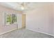 This bright bedroom is carpeted and features a large window with natural light at 2717 Warwick Ter, Palm Harbor, FL 34685