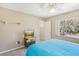 Bedroom featuring a media center, bed, carpeted floors, and a window at 2717 Warwick Ter, Palm Harbor, FL 34685