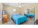 Bedroom featuring a mirrored closet, aquarium, and decorative window at 2717 Warwick Ter, Palm Harbor, FL 34685