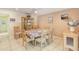 Bright dining room featuring a ceiling fan, tile floors, and dining table with six chairs at 2717 Warwick Ter, Palm Harbor, FL 34685