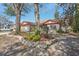 Beautiful home featuring a well-manicured front yard with garden at 2717 Warwick Ter, Palm Harbor, FL 34685