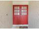 Close-up of the double front doors with glass panes and a decorative welcome mat at 2717 Warwick Ter, Palm Harbor, FL 34685