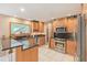 Modern kitchen with stainless appliances, granite countertops, and light wood cabinets at 2717 Warwick Ter, Palm Harbor, FL 34685