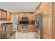 Well-equipped kitchen boasts stainless steel appliances, granite counters, and ample storage space at 2717 Warwick Ter, Palm Harbor, FL 34685