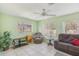 Cozy living room featuring tile flooring, recliner seating, and bright windows at 2717 Warwick Ter, Palm Harbor, FL 34685