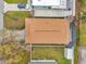 Detailed aerial shot of a home showcasing its roof, backyard, and surrounding landscape with a shed at 3116 W Abdella St, Tampa, FL 33607